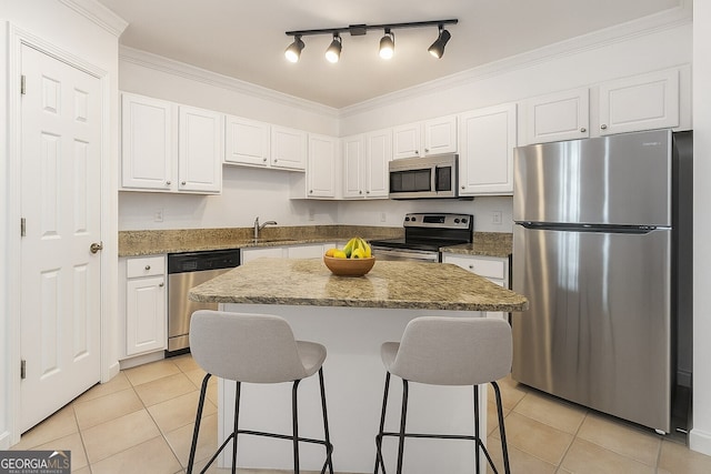 1850 Cotillion Dr Unit 4218, Atlanta, GA 30338 - kitchen featuring stainless steel appliances, a sink, light tile patterned flooring, a breakfast bar area, and crown molding
