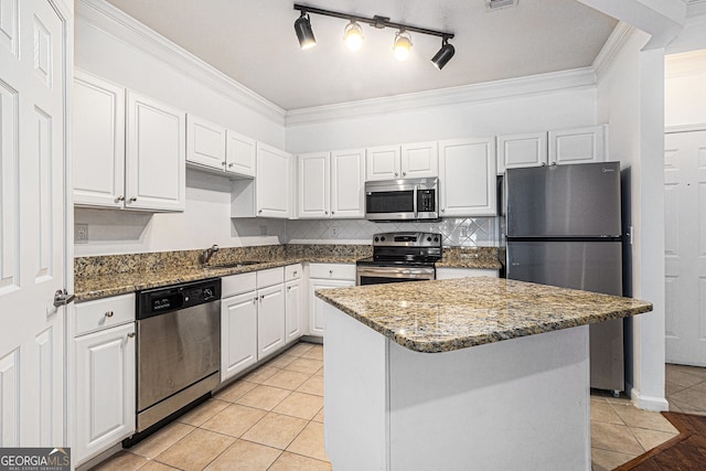 1850 Cotillion Dr Unit 4218, Atlanta, GA 30338 - kitchen featuring appliances with stainless steel finishes, a sink, ornamental molding, white cabinets, and light tile patterned floors