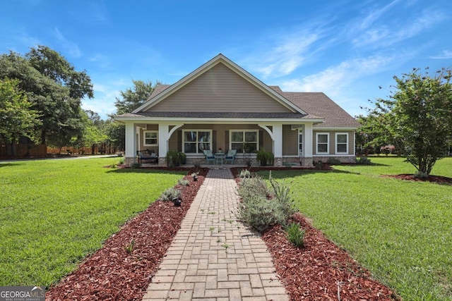 156 Hannah Dr, Jesup, GA 31546 - craftsman house with a porch, a front lawn, stone siding, and roof with shingles