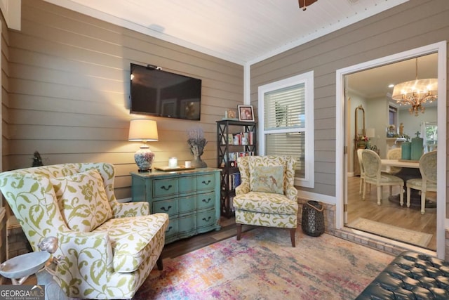 156 Hannah Dr, Jesup, GA 31546 - sitting room with wood finished floors, a chandelier, and wooden walls