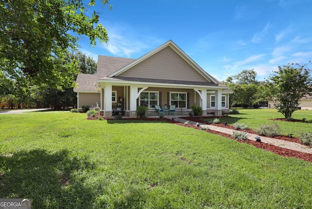 156 Hannah Dr, Jesup, GA 31546 - craftsman house featuring roof with shingles, a porch, and a front yard