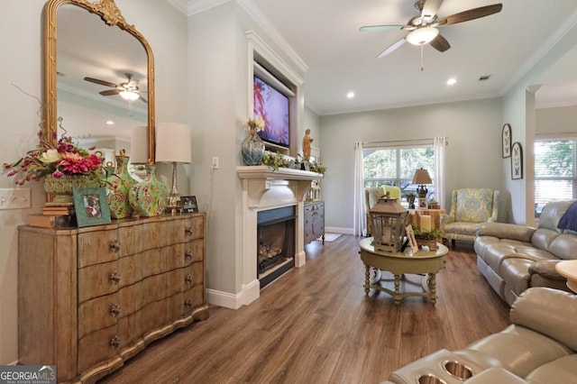 156 Hannah Dr, Jesup, GA 31546 - living area featuring a ceiling fan, healthy amount of natural light, wood finished floors, ornamental molding, and a fireplace