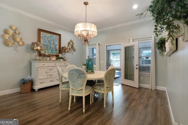 156 Hannah Dr, Jesup, GA 31546 - dining area with dark wood-style flooring, a chandelier, and crown molding