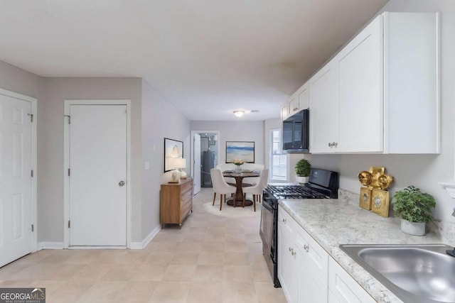 3075 Oakvale Hts, Decatur, GA 30034 - kitchen featuring black appliances, white cabinets, and light countertops