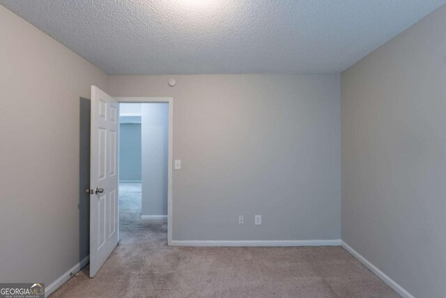 3075 Oakvale Hts, Decatur, GA 30034 - unfurnished room with carpet flooring, a textured ceiling, and baseboards