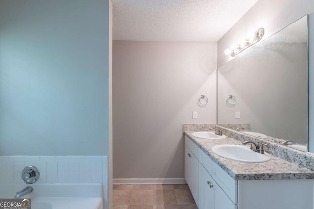 3075 Oakvale Hts, Decatur, GA 30034 - full bath featuring double vanity, a garden tub, a textured ceiling, and tile patterned floors