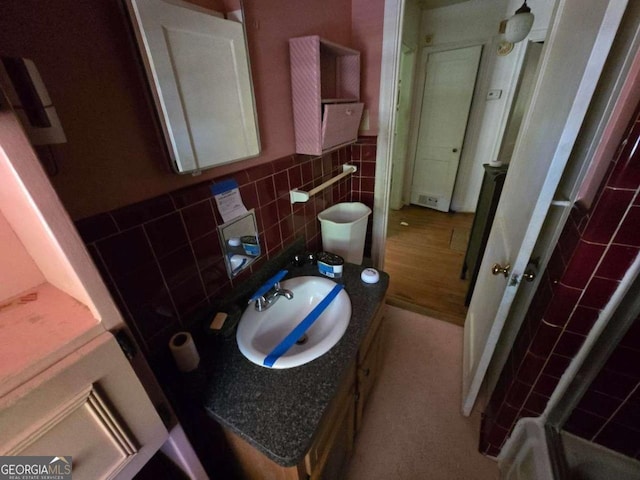 25 Candler Rd SE, Atlanta, GA 30317 - bathroom featuring tile walls, vanity, a shower, and wainscoting