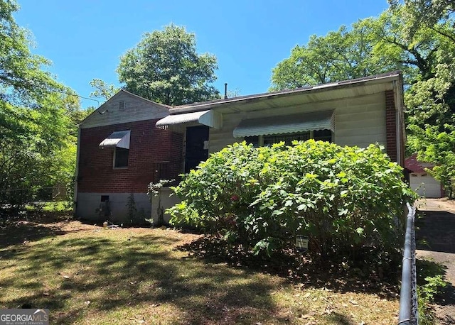 25 Candler Rd SE, Atlanta, GA 30317 - view of side of home with brick siding and a yard
