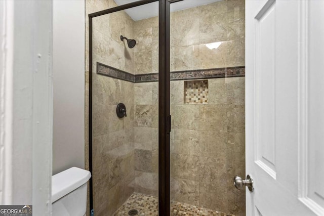 1101 Collier Rd NW Unit K2, Atlanta, GA 30318 - bedroom featuring wood finished floors, multiple closets, baseboards, and a ceiling fan