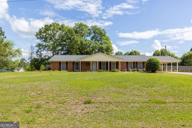 675 Mountain View Dr, Thomaston, GA 30286 - ranch-style home with a front yard, an attached carport, and brick siding