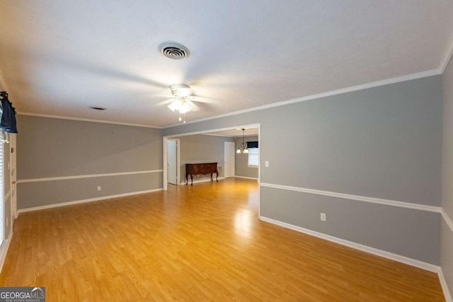 675 Mountain View Dr, Thomaston, GA 30286 - spare room with a ceiling fan, light wood finished floors, and crown molding