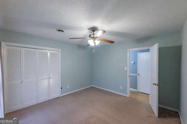 675 Mountain View Dr, Thomaston, GA 30286 - unfurnished bedroom with light colored carpet, a closet, and ceiling fan
