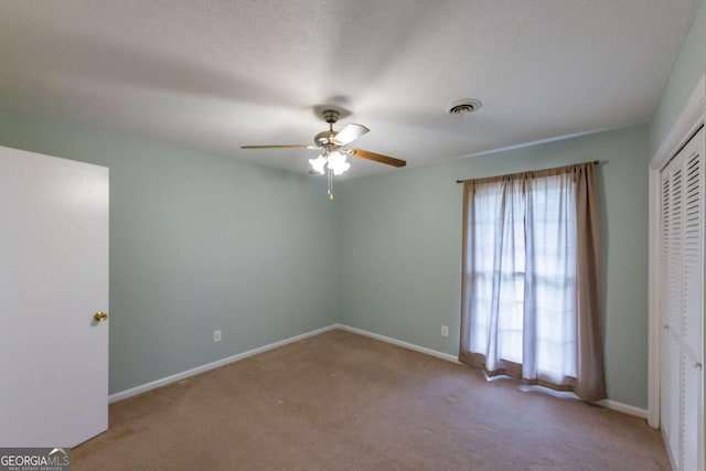 675 Mountain View Dr, Thomaston, GA 30286 - unfurnished bedroom featuring carpet flooring, a closet, and ceiling fan