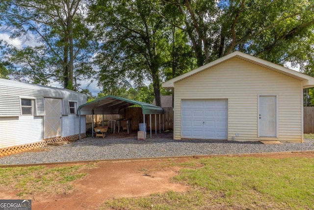 675 Mountain View Dr, Thomaston, GA 30286 - detached garage featuring gravel driveway and a carport