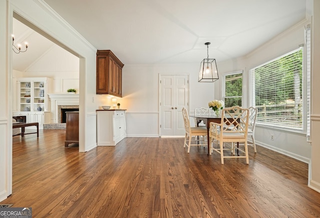 10310 Amberside Ct, Roswell, GA 30076 - dining space with crown molding, dark wood-style flooring, a fireplace, and baseboards