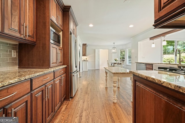 10310 Amberside Ct, Roswell, GA 30076 - kitchen with light wood-style floors, recessed lighting, decorative backsplash, appliances with stainless steel finishes, and light stone counters