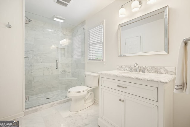 10310 Amberside Ct, Roswell, GA 30076 - bathroom featuring marble finish floors, vanity, a marble finish shower, toilet, and baseboards