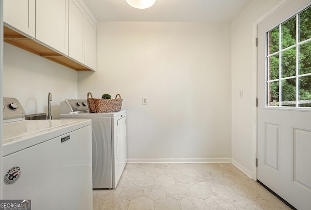 10310 Amberside Ct, Roswell, GA 30076 - laundry room with separate washer and dryer, cabinet space, baseboards, and light tile patterned floors