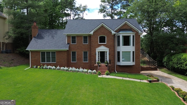 10310 Amberside Ct, Roswell, GA 30076 - colonial house with a chimney, a front lawn, brick siding, and concrete driveway