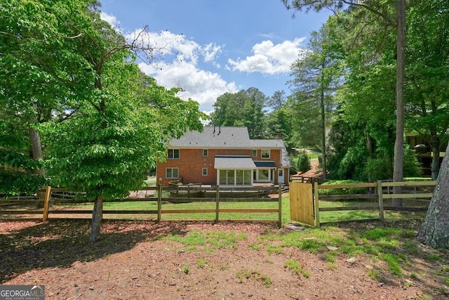 10310 Amberside Ct, Roswell, GA 30076 - rear view of property with a chimney and brick siding