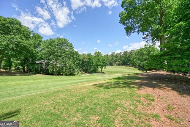 10310 Amberside Ct, Roswell, GA 30076 - view of property's community featuring view of golf course, a lawn, and view of scattered trees