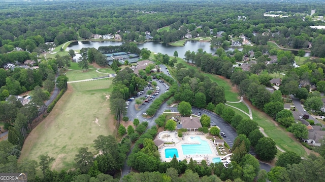 10310 Amberside Ct, Roswell, GA 30076 - aerial view of property and surrounding area featuring a large body of water, a heavily wooded area, and a pool