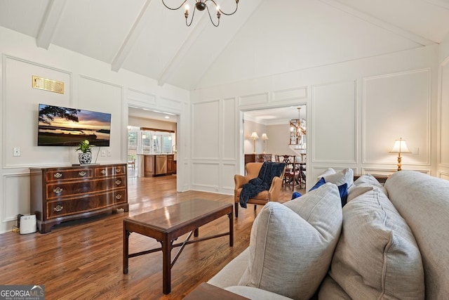 10310 Amberside Ct, Roswell, GA 30076 - living room featuring a decorative wall, a chandelier, wood finished floors, beamed ceiling, and high vaulted ceiling