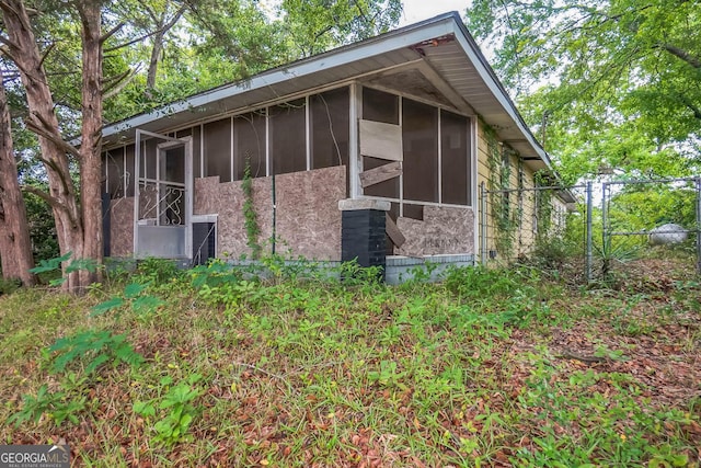 305 S 12th St, Cordele, GA 31015 - view of home's exterior with a sunroom and fence