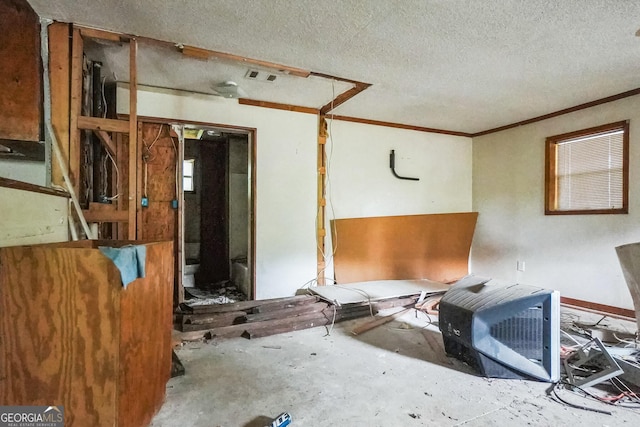 305 S 12th St, Cordele, GA 31015 - empty room with a textured ceiling and crown molding