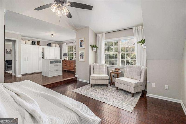 bedroom with baseboards, dark wood-style flooring, vaulted ceiling, and ceiling fan