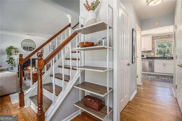 staircase featuring wood finished floors