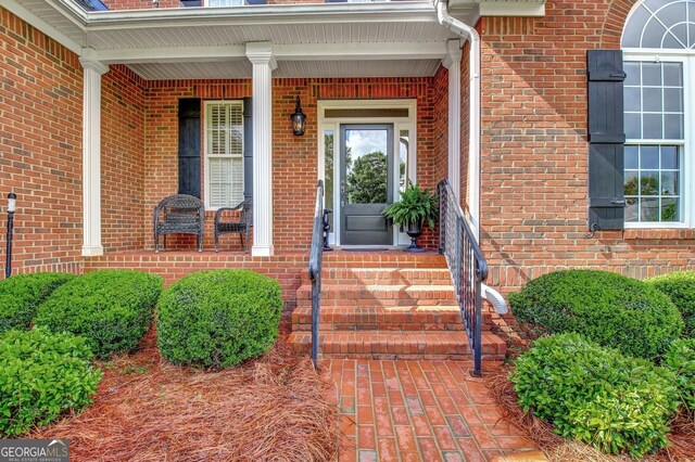 150 Bay Dr, Newnan, GA 30263 - view of exterior entry featuring brick siding and covered porch