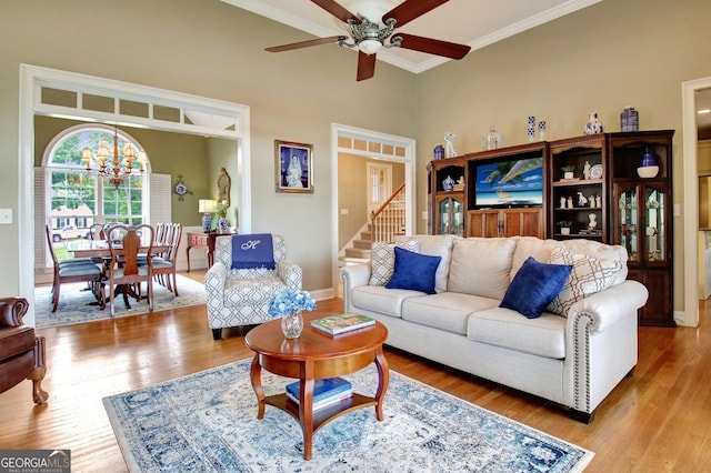 150 Bay Dr, Newnan, GA 30263 - living area with wood finished floors, ceiling fan, ornamental molding, a chandelier, and baseboards