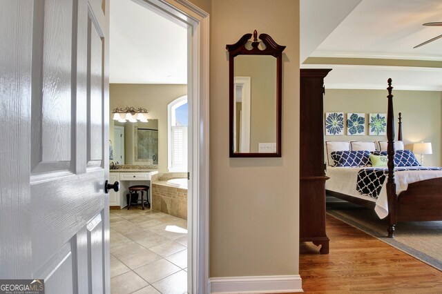 150 Bay Dr, Newnan, GA 30263 - hallway with light tile patterned floors and ornamental molding