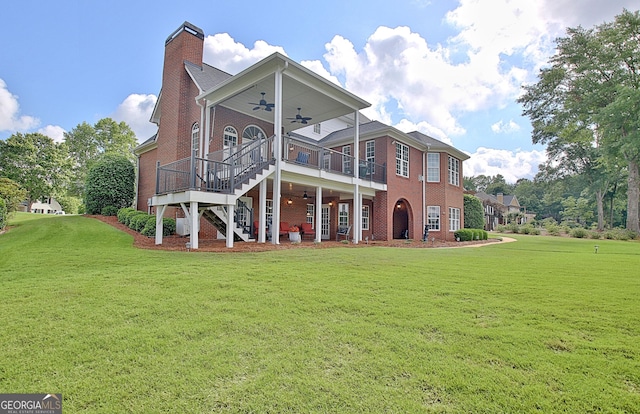 150 Bay Dr, Newnan, GA 30263 - rear view of property featuring ceiling fan, a yard, stairs, brick siding, and a wooden deck