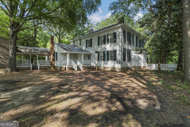 171 N Jefferson Ave, Talbotton, GA 31827 - rear view of house featuring fence and covered porch