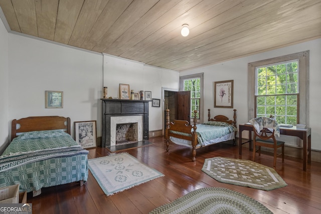 171 N Jefferson Ave, Talbotton, GA 31827 - bedroom with wood ceiling, hardwood / wood-style flooring, and a fireplace