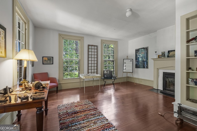 171 N Jefferson Ave, Talbotton, GA 31827 - living room featuring a fireplace with flush hearth and wood finished floors