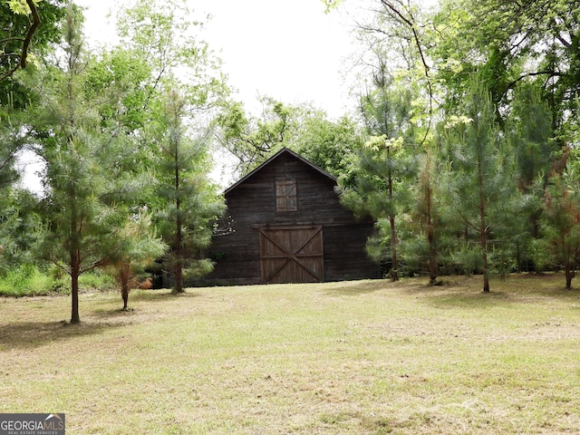 171 N Jefferson Ave, Talbotton, GA 31827 - view of grassy yard with a barn and an outbuilding