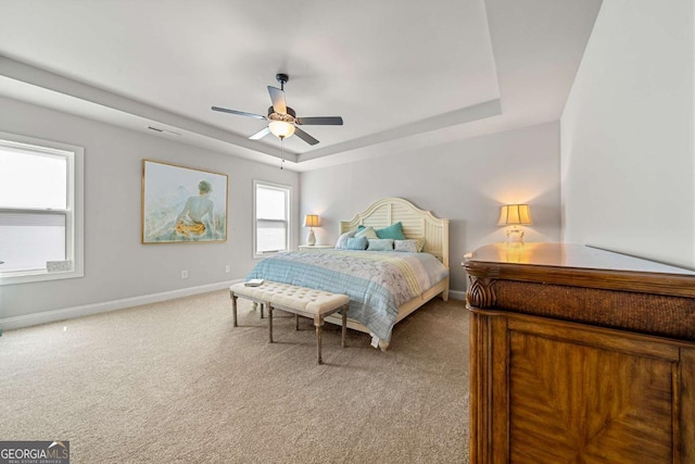 75 Georgian Oaks Ct, Newnan, GA 30265 - bedroom with a raised ceiling, carpet floors, baseboards, and a ceiling fan