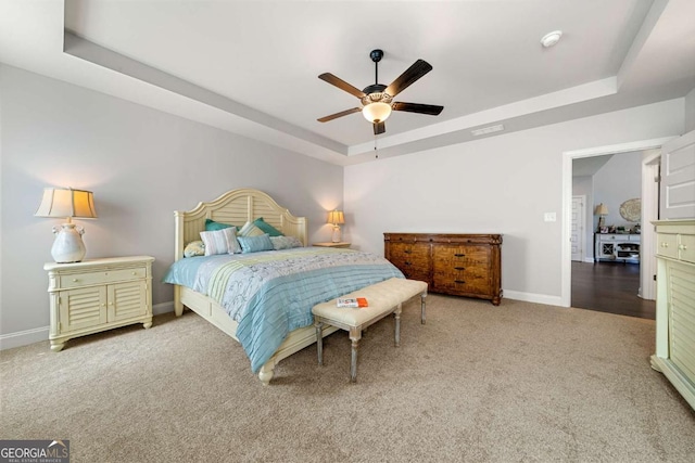 75 Georgian Oaks Ct, Newnan, GA 30265 - carpeted bedroom with a raised ceiling, baseboards, and ceiling fan