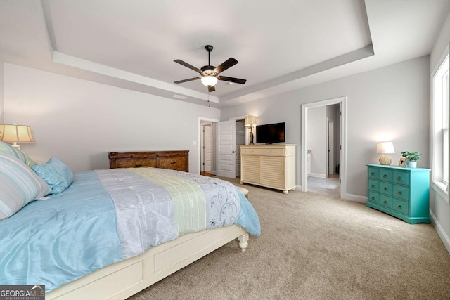 75 Georgian Oaks Ct, Newnan, GA 30265 - bedroom with a raised ceiling, carpet flooring, baseboards, and a ceiling fan