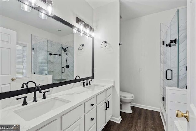 613 Wiley Ct, Canton, GA 30115 - bathroom with a stall shower, double vanity, and wood finished floors