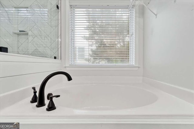 613 Wiley Ct, Canton, GA 30115 - bathroom featuring a bath and a shower stall