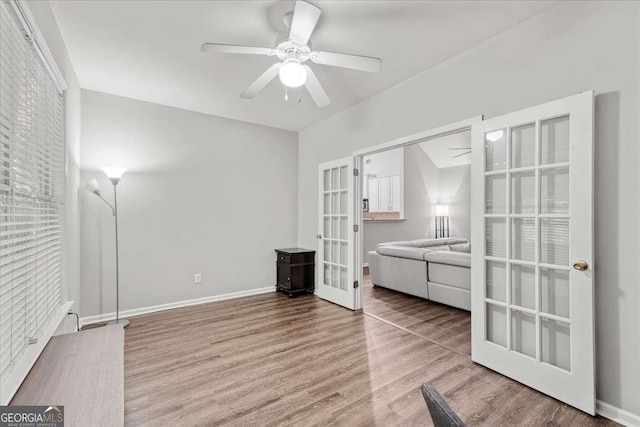 613 Wiley Ct, Canton, GA 30115 - unfurnished bedroom with french doors, wood finished floors, and ceiling fan