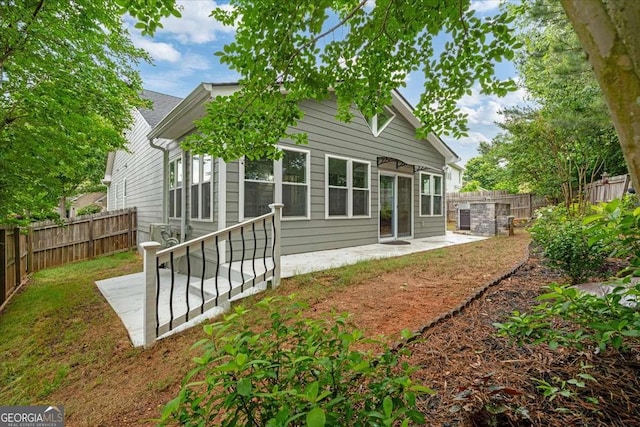 613 Wiley Ct, Canton, GA 30115 - back of house with a patio area and a fenced backyard