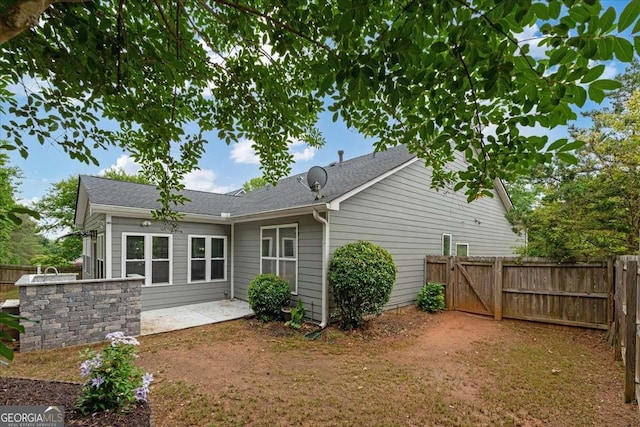 613 Wiley Ct, Canton, GA 30115 - back of property with a patio, a gate, and a shingled roof