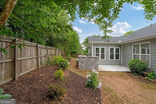 613 Wiley Ct, Canton, GA 30115 - fenced backyard with a patio area