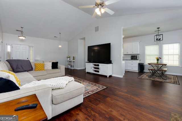 living room featuring dark wood finished floors, a ceiling fan, baseboards, and high vaulted ceiling