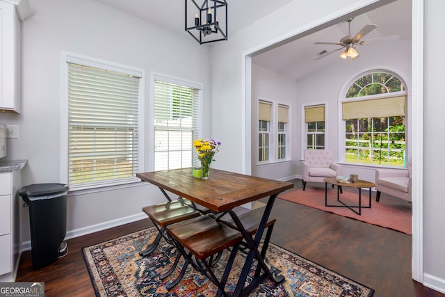 dining area with plenty of natural light, vaulted ceiling, ceiling fan, and dark wood finished floors